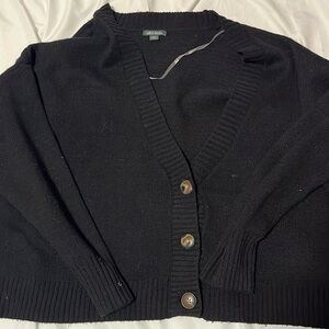 woman’s large v-neck, cropped button up sweater